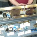 A person standing in front of some electronic equipment.